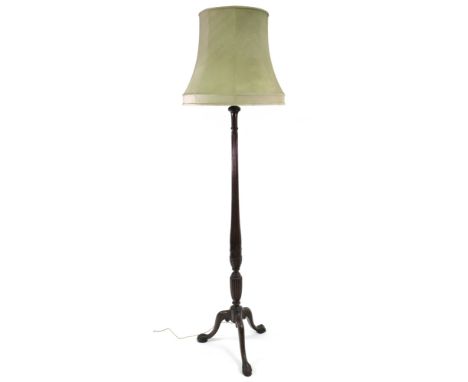 A Hepplewhite style mahogany turned, reeded and carved column standard lamp, on tripod base, 159cm high, with shade (2).