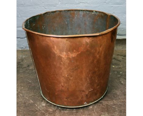 A large circular copper log cistern, 44cm diameter, 37cm high, copper and brass kettle, brass oil lamp, adapted for electrici