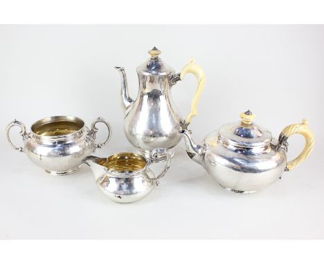 A Victorian silver matched four piece tea and coffee set, circular baluster form with scroll handles, makers R & S Garrard & 