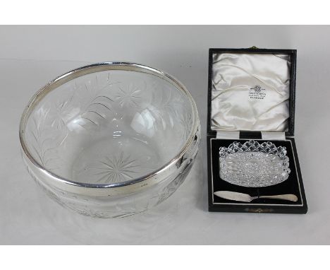 A George VI silver butter knife and cut glass butter dish in fitted case, together with a silver mounted glass fruit bowl, 20