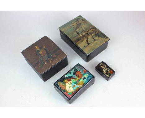 A collection of four Russian black lacquer boxes, one depicting a snowy scene, marked  Feyiekani, Kobanal (?), another of a s