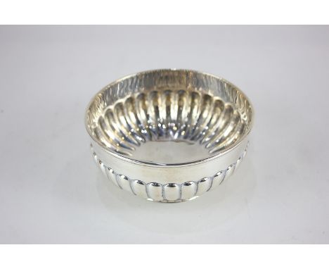 A Victorian silver circular pedestal bowl with demi reeded decoration, maker Dobson and Sons, London 1881, 5.5oz, diameter 12