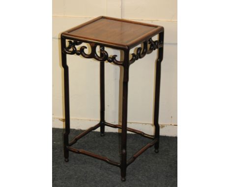 A Chinese rosewood side table, square top with pierced scroll frieze, on shaped legs with low stretcher, 34cm