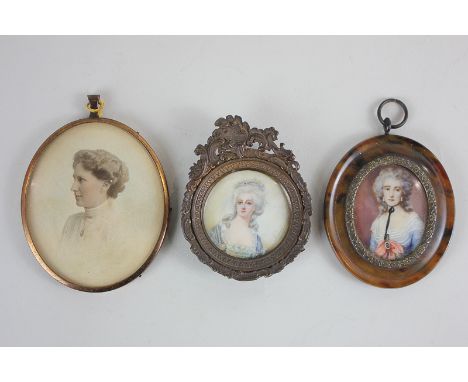 A circular miniature portrait of a lady, possibly Madame de Montesson, wearing a blue lace trimmed gown, inscribed Raynal, pa