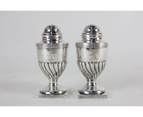 A pair of Edward VII silver peppers, maker R & S Garrard & Co, London 1905, crested, 2.5oz