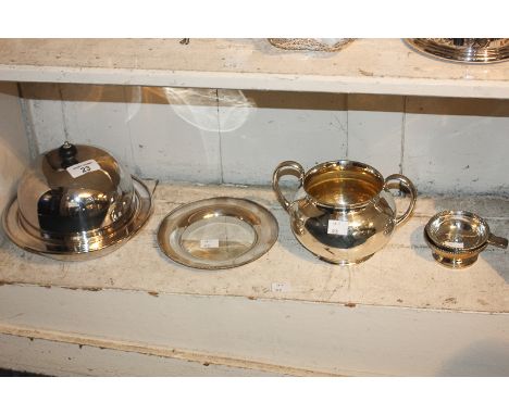 A Mappin & Webb silver plated muffin dish and cover, an Elkington & Co two-handled sugar bowl, a tea strainer and bowl, and a