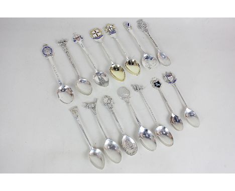 A collection of fourteen mixed silver commemorative teaspoons including Australian cities, some marked 800, sterling and hall