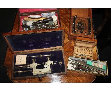 An interesting collection of watch and clock makers' tools, including a polishing tool stamped DLPP, a German cased set of di