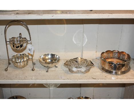 A silver plated sugar and cream set on stand, a coaster, small pierced dish, and Mappin & Webb sugar bowl, on hoof feet