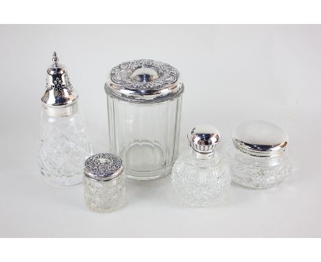 A modern silver topped glass scent bottle with stopper, a sterling silver topped cylindrical jar with engraved name and date 