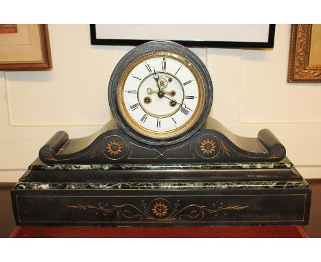 A Victorian black slate and green marble mantel clock, the dial with visible movement and Roman numerals, the movement missin