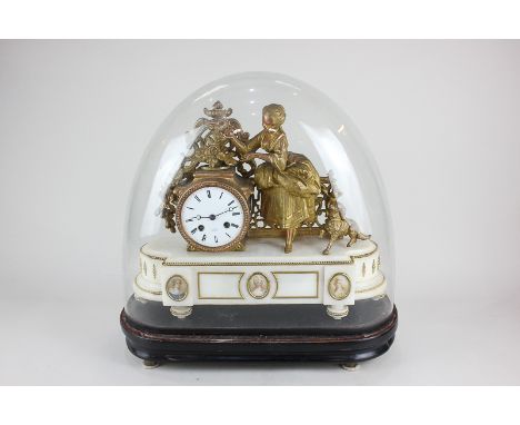 An early 19th century gilt figural drum cased mantel clock by Henry Marc, Paris, decorated with a woman feeding a bird from h