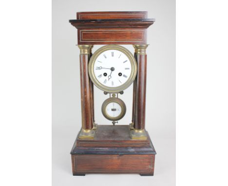 A 19th century rosewood and brass Portico clock, the circular dial with Roman numerals, the movement marked G & C, striking o