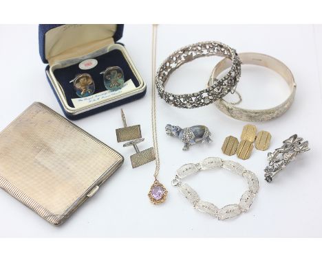 A pair of 9ct gold cufflinks, two pairs of silver cufflinks, two silver bangles, an amethyst in 9ct pendant, a paste set bang