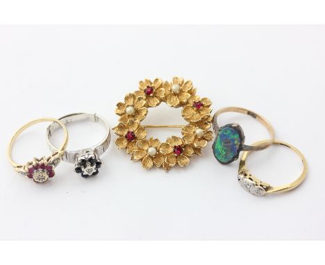 Three illusion set gem rings, a black opal doublet ring, and a gilt metal floral brooch