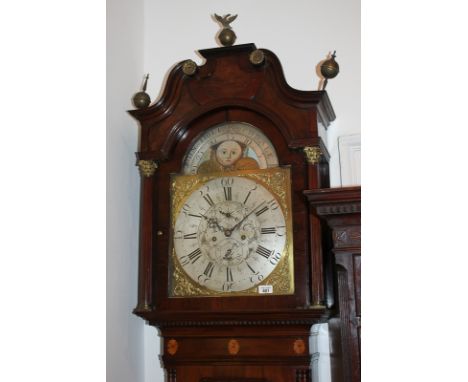 A 19th century flame mahogany longcase clock by John Holt, Rochdale, the 14 inch domed brass dial with faces of the moon, scr