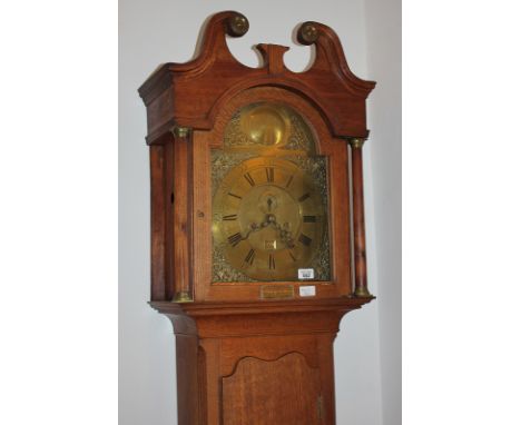 A George III oak longcase clock by John Kirkwood Redpath, the 11.5 inch domed brass dial signed, with scrolling urn spandrels