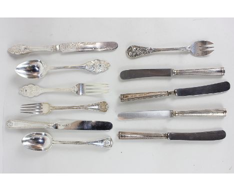 Two Victorian silver three piece christening sets of knife, fork and spoon, four silver handled dessert knives with stainless