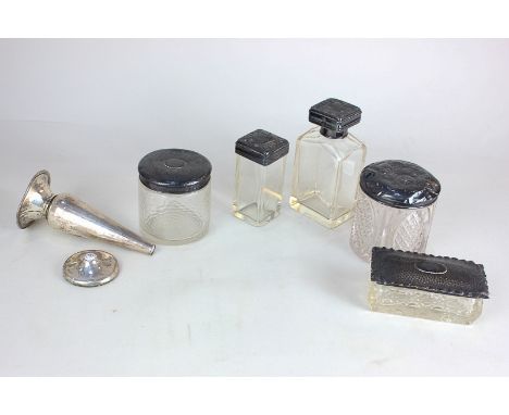 Five various silver topped glass dressing table jars including a late Victorian perfume bottle with screw top hallmarked Birm