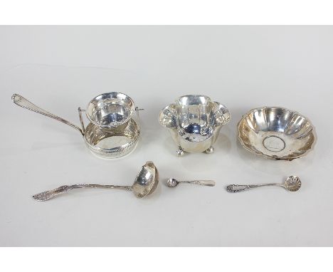 A Continental 800 silver circular trinket dish, the base inset with an Austrian coin dated 1937, 9.5cm, a tea strainer and st