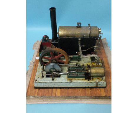 A large live steam horizontal stationary engine with 17cm diameter fly wheel, base 50cm square, funnel 33cm, (untested).