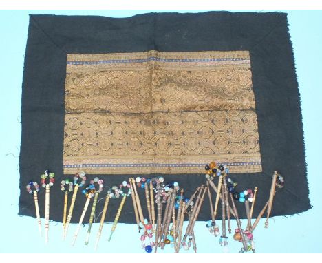 A bone bobbin inscribed Thomas Hayes Died March 9th 1837, other bone and wooden bobbins, (33) and a Chinese embroidered panel