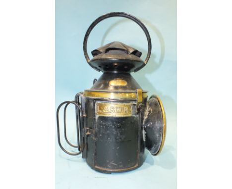 A Japanned LSWR four-aspect hand lamp with brass label and detail, stamped 'Tower Hill' on the side, complete with burner, re
