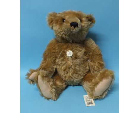 Steiff, a 1903 Classic replica teddy bear with button to ear and tags attached, 50cm.