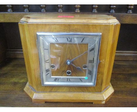 A mid 20th century walnut 8 day mantle clock, striking on nine rods 