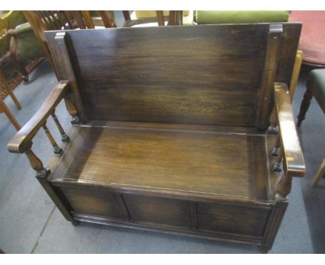 An early 20th century oak monks bench, 35 1/4" H x 40 1/2" W 
