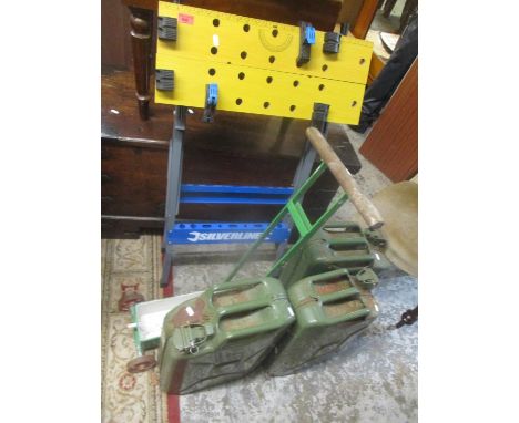 Three green petrol cans, together with a vintage line painter and a Silverline folding workbench 
