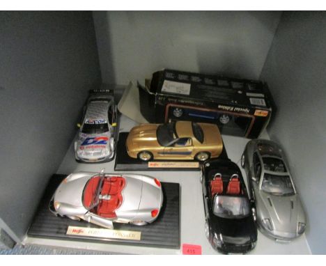 A group of diecast model display cars to include a Maisto Porsche Boxter and a Beanstalk Group Aston Martin Vanquish 