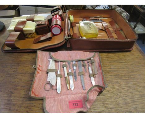 A vintage leather travelling case with ivory hair brushes and a mid 20th century gentleman's grooming set 