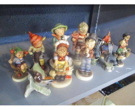 A selection of Hummel figures, together with three Beswick bird ornaments 