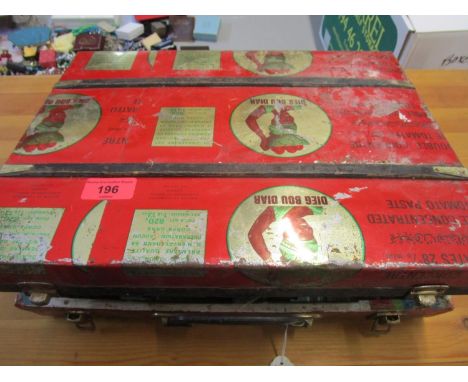 A mid 20th century tin trunk/suitcase containing Dunlop sixty five boxed and loose golf balls 