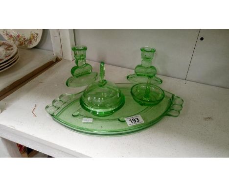 A green glass trinket set