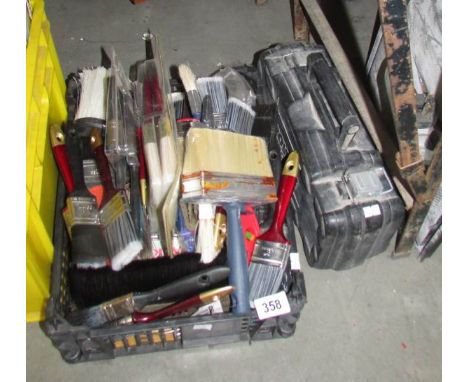A quantity of new paintbrushes and other tools