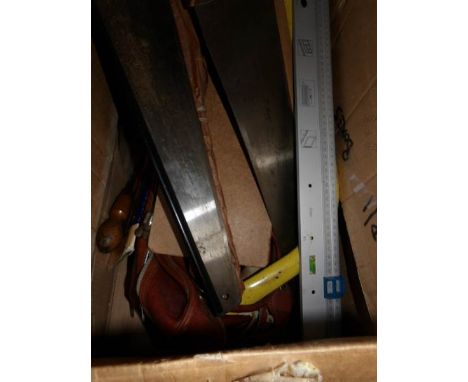 A large box of tools including wood saws