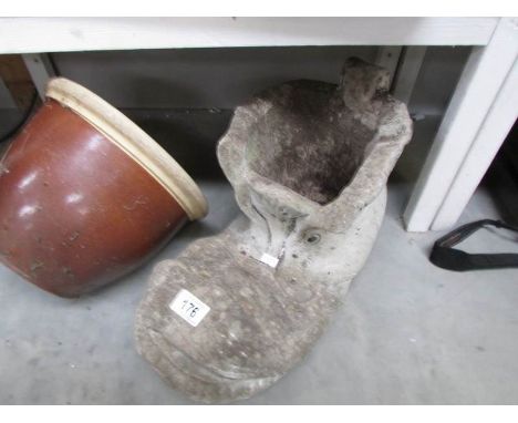 A garden planter as a boot and one other