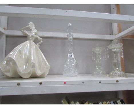 A pair of glass lustre candle holders, a decanter and an art deco lustre lady figure