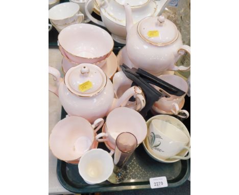 A Tuscan china part tea service, on a pink ground, comprising teapot, coffee pot, tea cups and saucers, milk jug, sugar bowl,