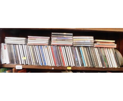 A group of CDs, to include Queen, Vivaldi, Neil Diamond, and others. (1 shelf) 