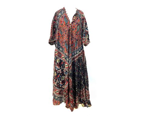 A mixed lot of printed dresses and robes to include; a blue quilted robe, a red batik geometric style dress, two paisley prin
