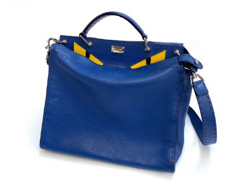 A Fendi Selleria Peekaboo Monster blue leather crossbody bag, with yellow leather eyes and red leather pocket lining, serial 