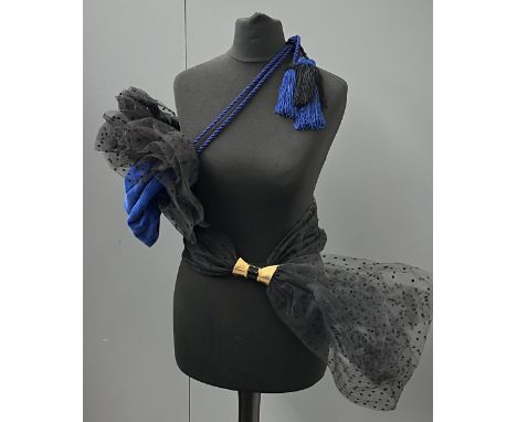 An Isabel Canovas bag and sash set, to include blue velvet bag with rope strap and black net ruffle, together with black net 