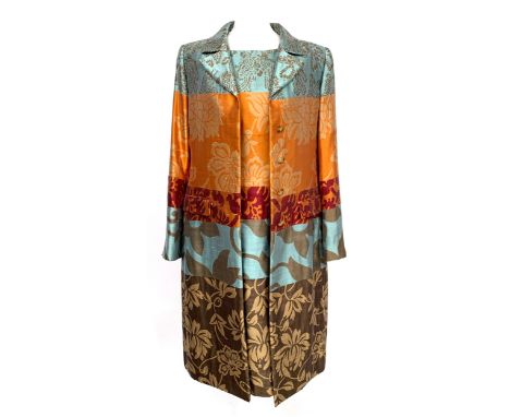 An Oscar de La Renta sleeveless silk dress in panels of blue, orange and purple floral designs, US size 6, together with a ma