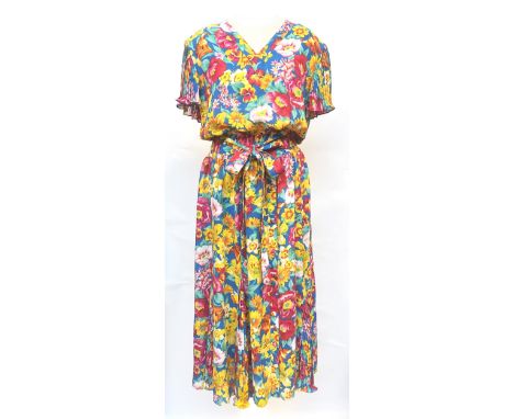 A 1980s Kanga Collection tropical print women's dress, with shoulder pads and knife pleat sleeves, chest 40", together with a
