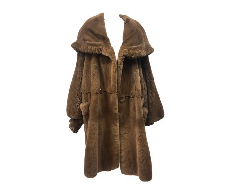 Reversible shearing and suede coat with hood, both sides featuring two patch pocket and button closures, top toggle closure A