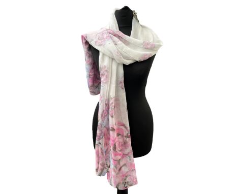 A Chanel silk chiffon scarf, base in pistachio green with lion face design, ends with pink roses and 'Chanel' imprint, hand r