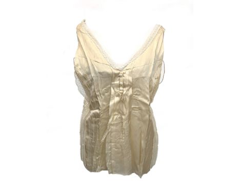 A Chloé silk and lace top in creme, with cotton lace panels, low V neck, button up back, EU size 40, 39" chest
